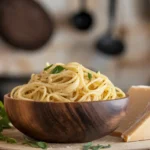 a deliciously plated spaghetti aglio e olio, capturing the simplicity and elegance of this classic Italian dish. Let me know if you need any adjustments or additional details!